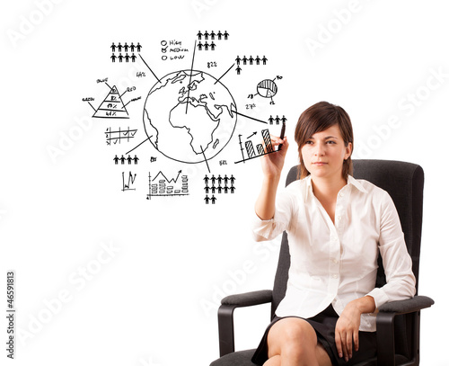 Photo: Young woman drawing globe with diagrams isolated on white Young woman drawing globe with diagrams isolated on white