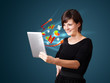 Young woman looking at modern tablet with abstract lights and va