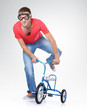 Man on a children's bicycle