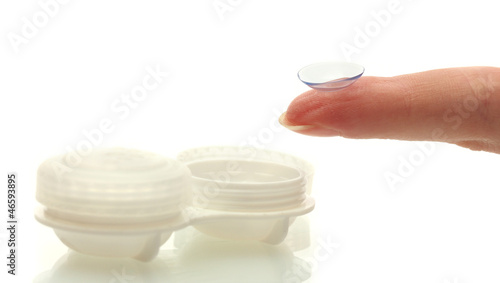 Photo: contact lens on finger and case isolated on white contact lens on finger and case isolated on white