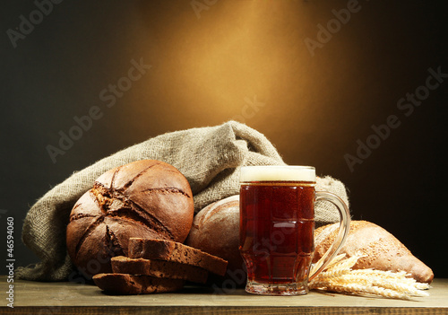 Photo: tankard of kvass and rye breads with ears, tankard of kvass and rye breads with ears,