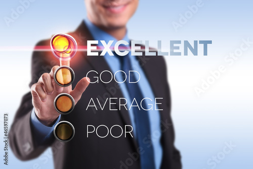 Photo: business man pushing Excelent button business man pushing Excelent button