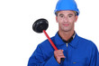 craftsman holding a plunger