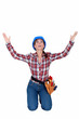 craftswoman kneeling and raising hands