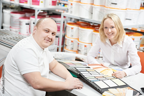 Photo: Seller and buyer selecting paint color Seller and buyer selecting paint color