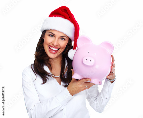 Photo: Santa Christmas business woman with a piggy bank. Santa Christmas business woman with a piggy bank.
