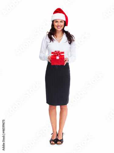 Photo: Santa helper business woman with a present. Santa helper business woman with a present.