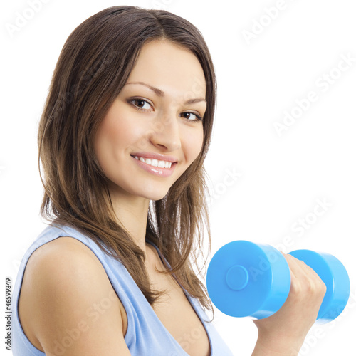Photo: Young woman exercising with dumbbell, isolated Young woman exercising with dumbbell, isolated