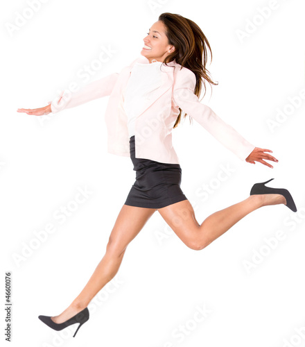 Photo: Business woman taking a big step Business woman taking a big step
