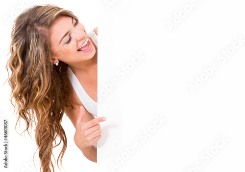 Photo: Woman pointing at a banner Woman pointing at a banner