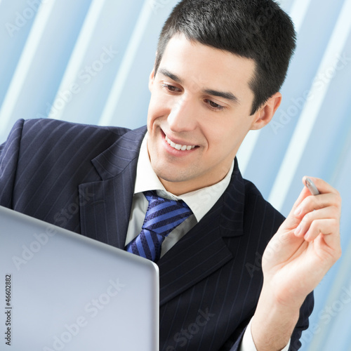 Photo: Businessman working with laptop Businessman working with laptop