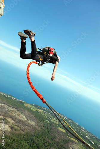 Photo: Jump off a cliff with a rope. Jump off a cliff with a rope.