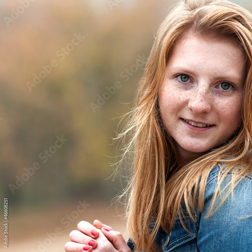 Photo: portrait of a beautiful girl with freckles, close-up portrait of a beautiful girl with freckles, close-up