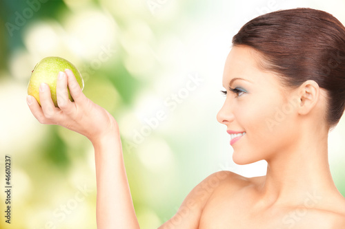 Photo: young beautiful woman with green apple young beautiful woman with green apple