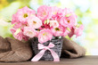bouquet of eustoma flowers in  wicker vase,