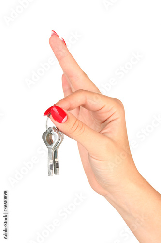 Photo: Hand with keys isolated on white Hand with keys isolated on white