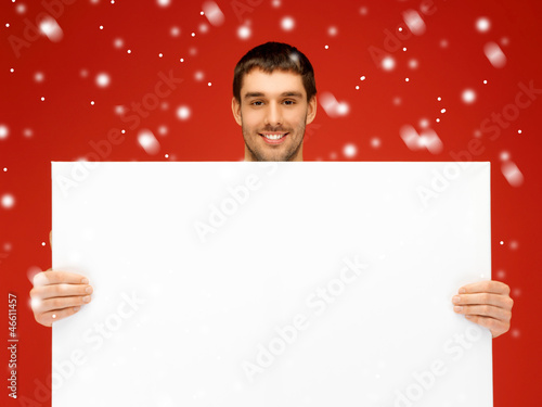 Photo: handsome man with big blank board handsome man with big blank board