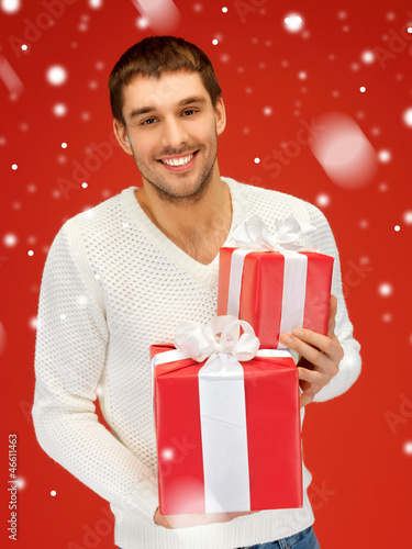 Photo: man holding many gift boxes man holding many gift boxes