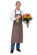 Florist spraying a bouquet of flowers