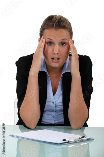 Photo: Shocked blond office worker Shocked blond office worker