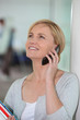 Happy woman talking on her mobile phone