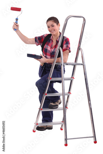 Photo: Woman with paint roller and step-ladder Woman with paint roller and step-ladder
