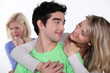 Couple in love ignoring their friend
