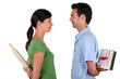 Couple stood facing each other