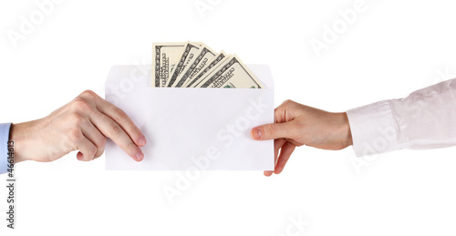 Photo: woman's hand passes the envelope with dollars woman's hand passes the envelope with dollars