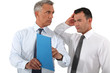 Businessman reprimanding his employee