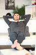Man relaxing on a sofa