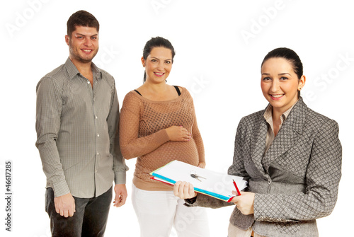 Photo: Happy couple and real estate agent Happy couple and real estate agent