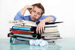 Bored businessman leaning on a stack of files