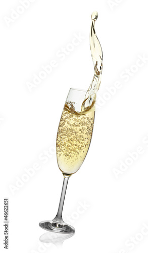 Photo: Flute with abstract splash of champagne. Flute with abstract splash of champagne.