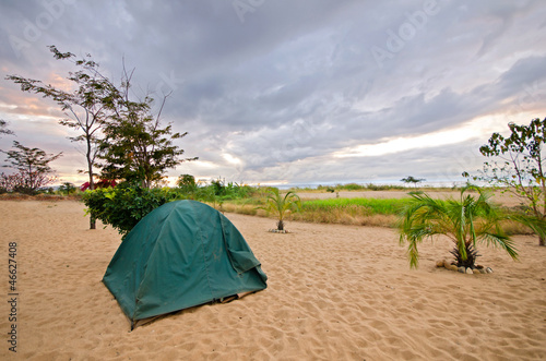 Photo: Tent on the Beach with dramatic sky Tent on the Beach with dramatic sky