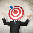businessman with dartboard on head