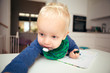 Blonde infant in home setting