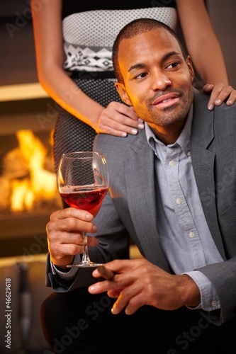 Photo: Goodlooking man with cigar and glass of wine Goodlooking man with cigar and glass of wine