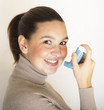 Cute girl with asthma inhalator
