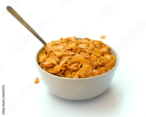Photo: Bowl of corn flake cereal with a spoon Bowl of corn flake cereal with a spoon
