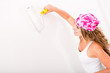 Woman painting the wall