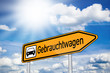 Schild mit Gebrauchtwagen und Sonne
