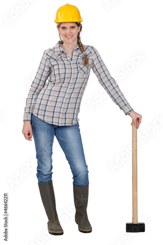 Photo: Construction worker with a sledgehammer. Construction worker with a sledgehammer.