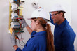 Man and woman measuring voltage