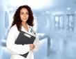 Photo: Doctor woman with a clipboard in the hospital Doctor woman with a clipboard in the hospital