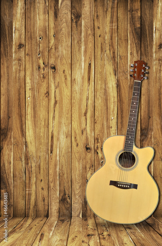 Photo: acoustic guitar on wood background acoustic guitar on wood background