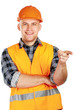 Photo: A young construction worker pointing something A young construction worker pointing something