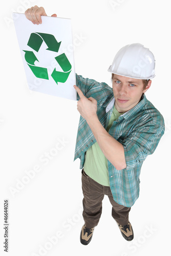 Photo: Builder pointing at recycle poster Builder pointing at recycle poster