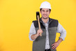Smiling laborer on yellow background