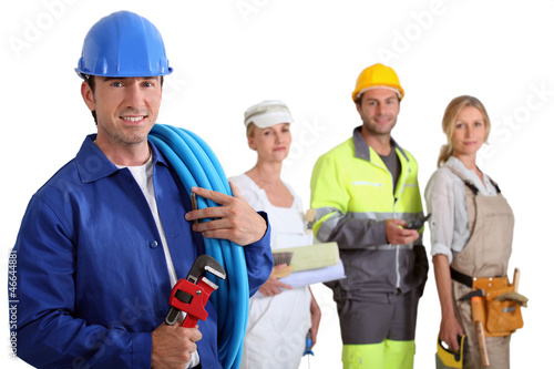 Photo: Various workers stood in row Various workers stood in row